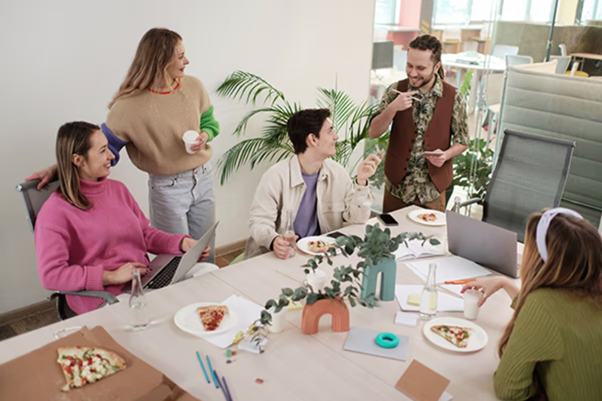 Business lunch meeting representing small business spending and debit card rewards with a Westerra Credit Union business checking account.