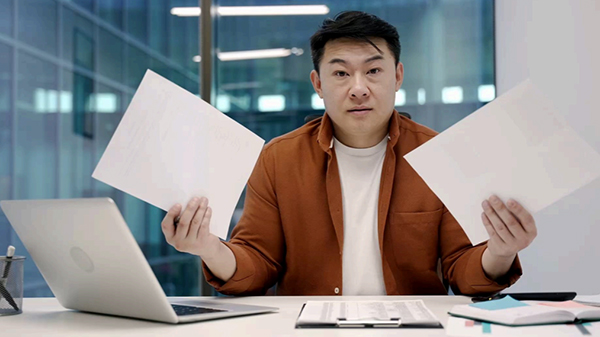 Man confused with laptop. 