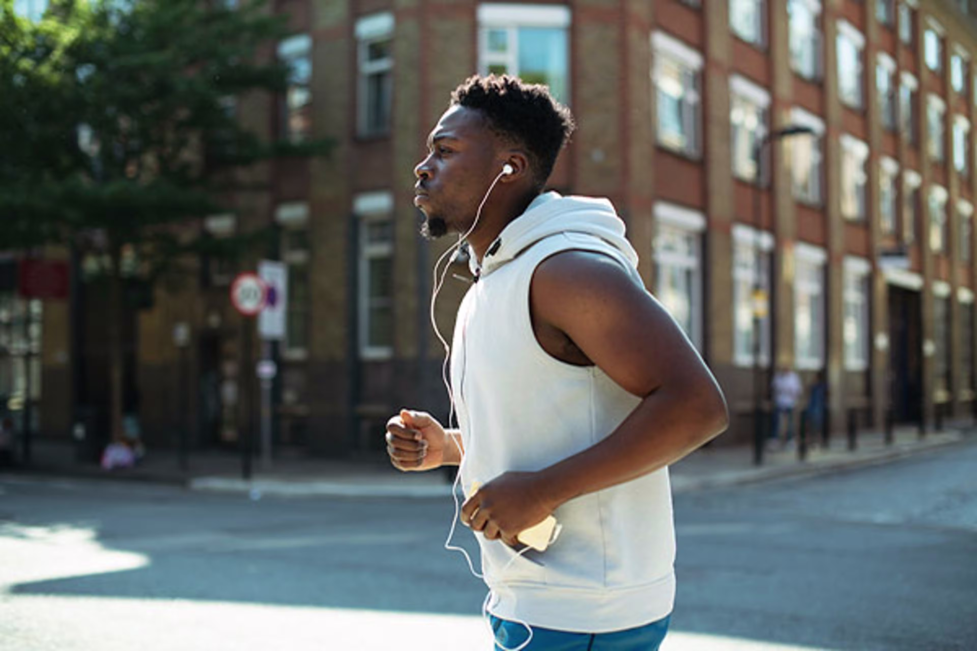 Man jogging with headphones, with overlay text 'VA Mortgage'—Westerra proudly supports veterans in Colorado with specialized home loan options.