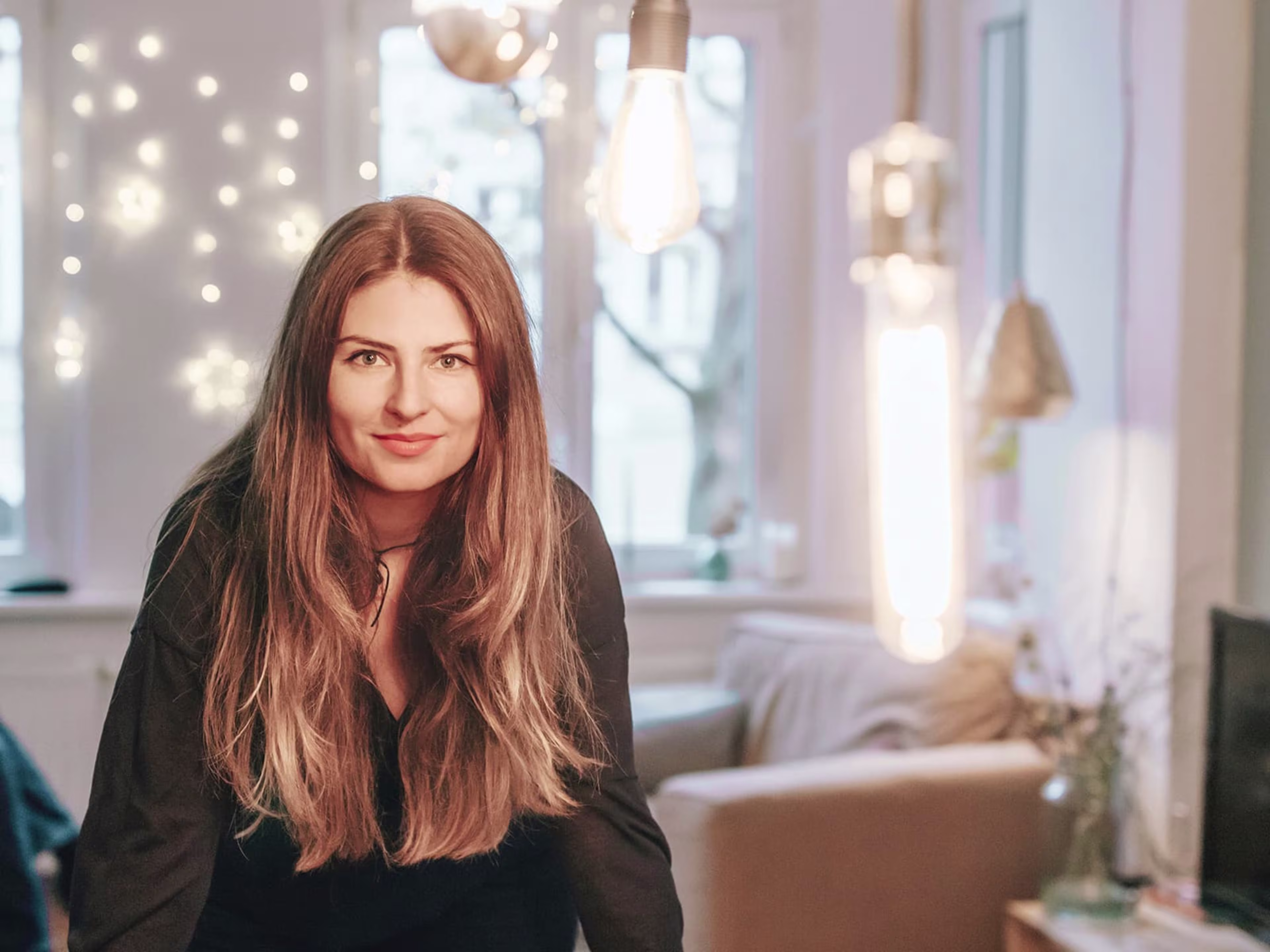 Woman sitting in her apartment