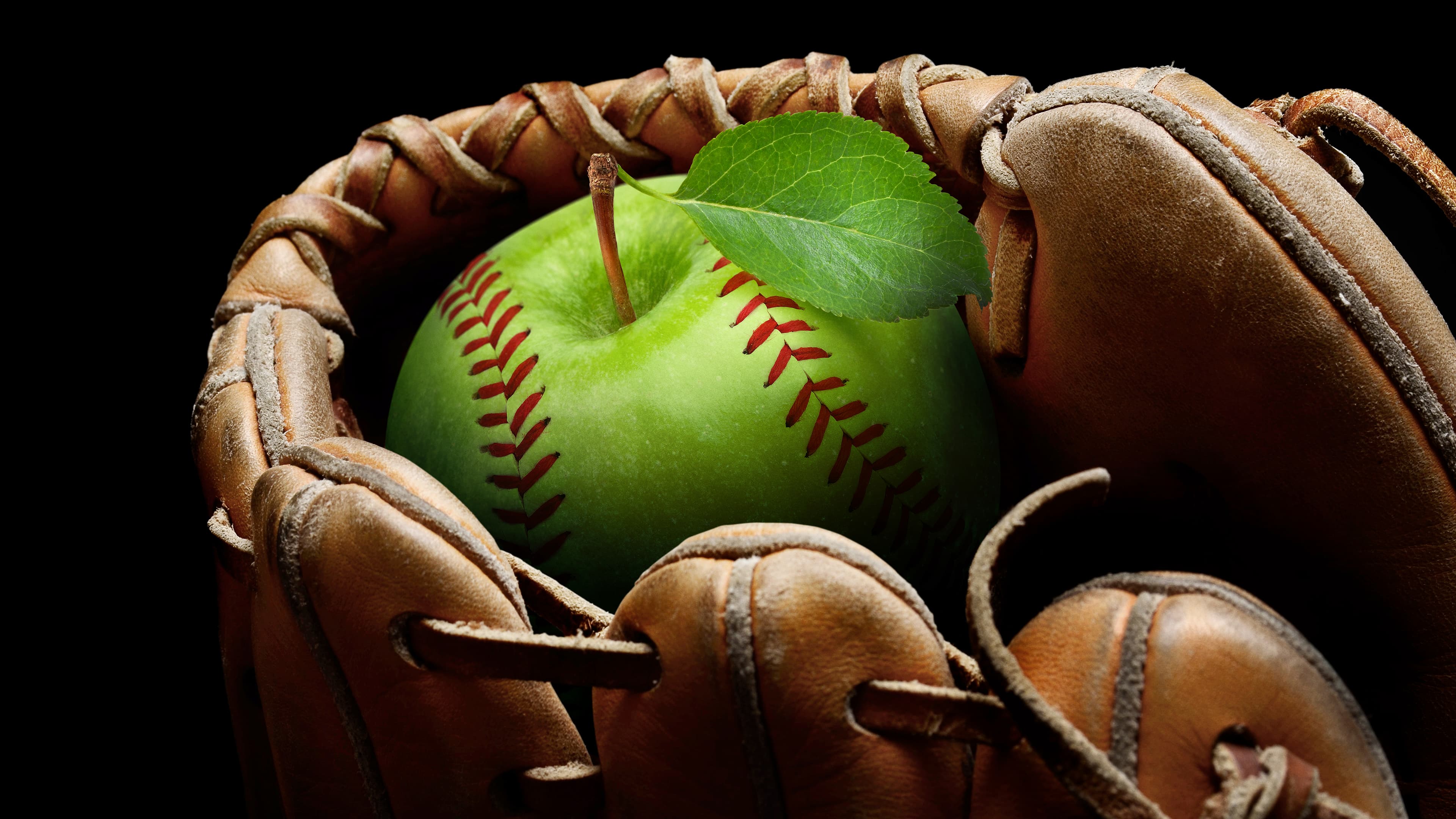 Baseball glove with an apple inside
