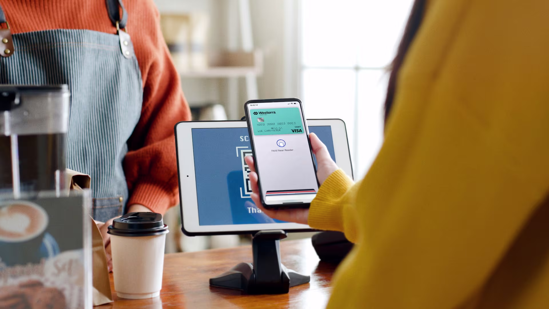Customer using their phone to pay in a store
