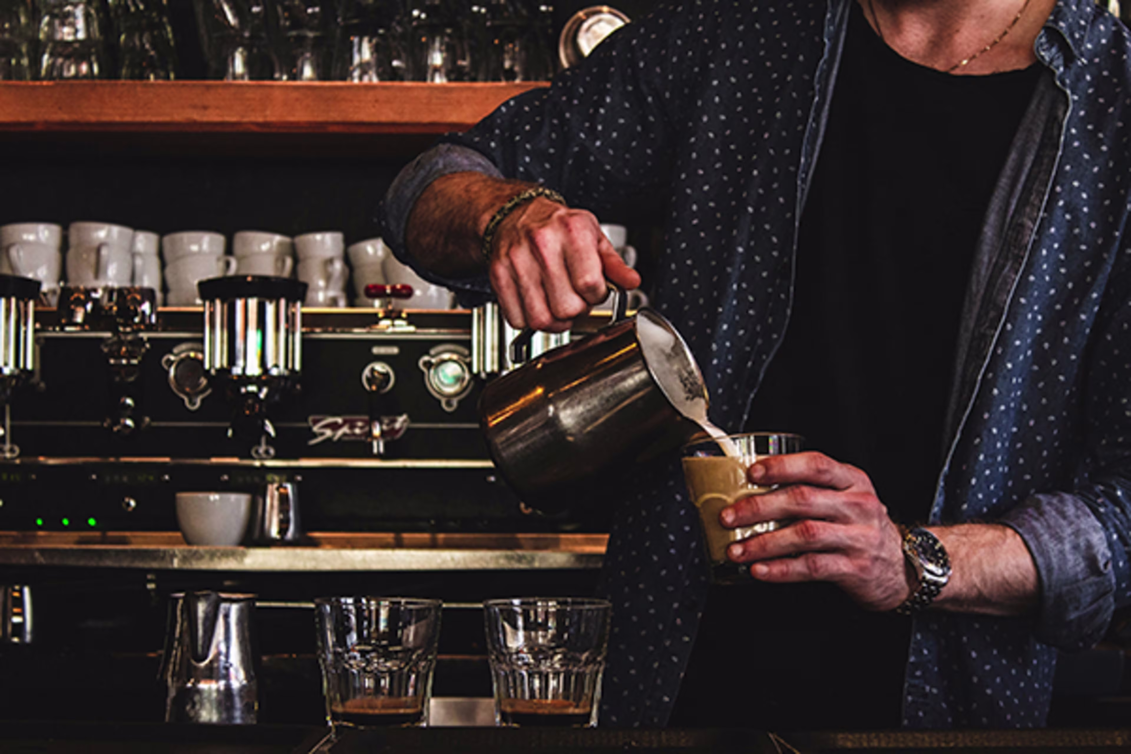 Local small business owner pouring coffee, representing everyday moments powered by a Business Line of Credit