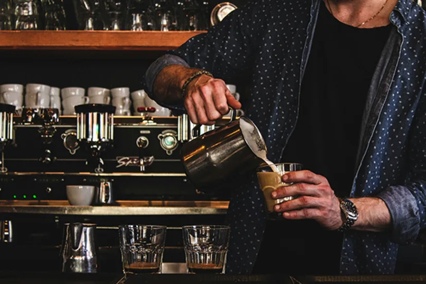 Local small business owner pouring coffee, representing everyday moments powered by a Business Line of Credit
