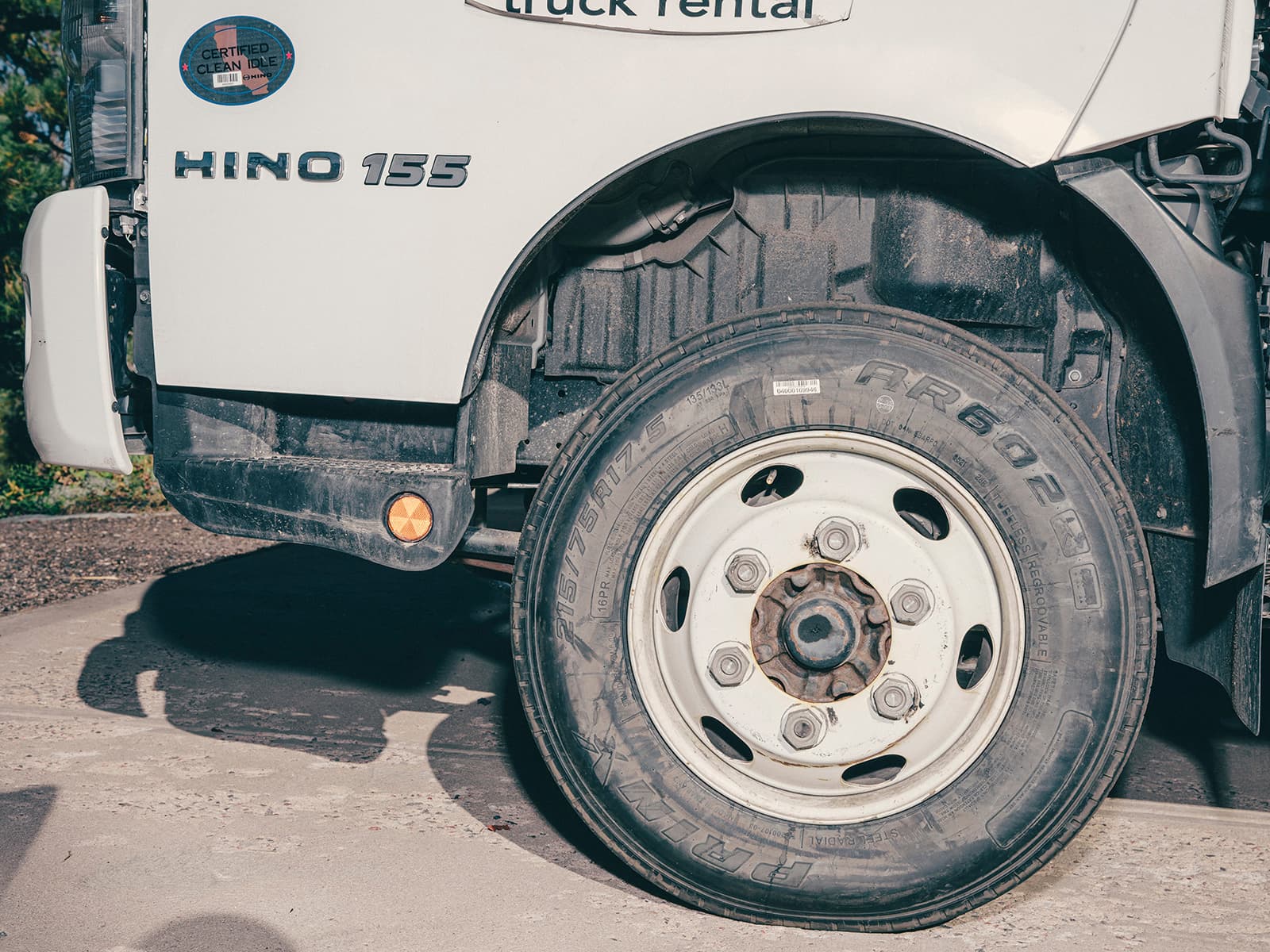 Close-up of the front tire of a white semi-truck