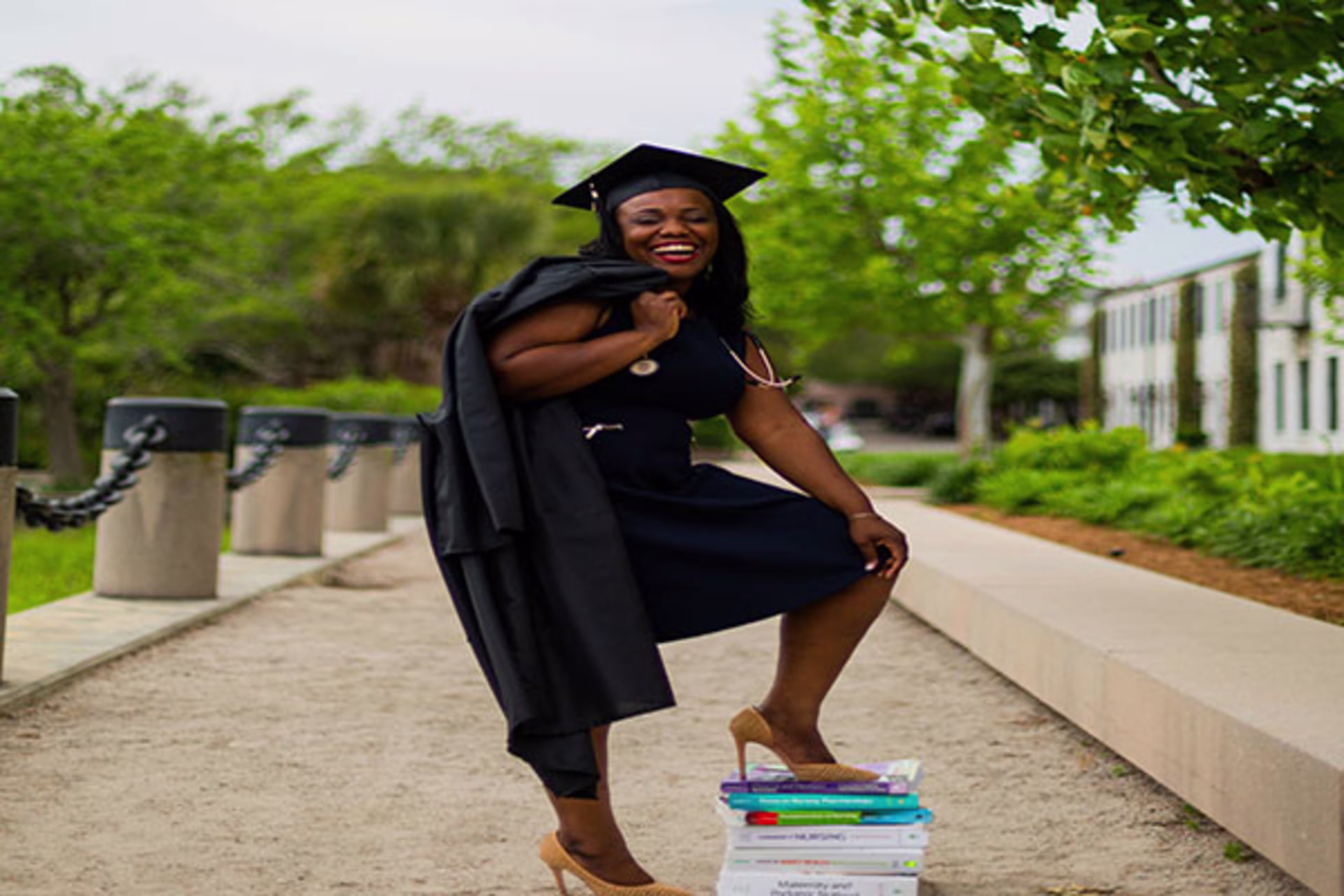 College graduate in cap and gown, symbolizing new beginnings and career success—ideal for those considering Physician Mortgage Loans and Dentist Mortgage options to help secure their first home.