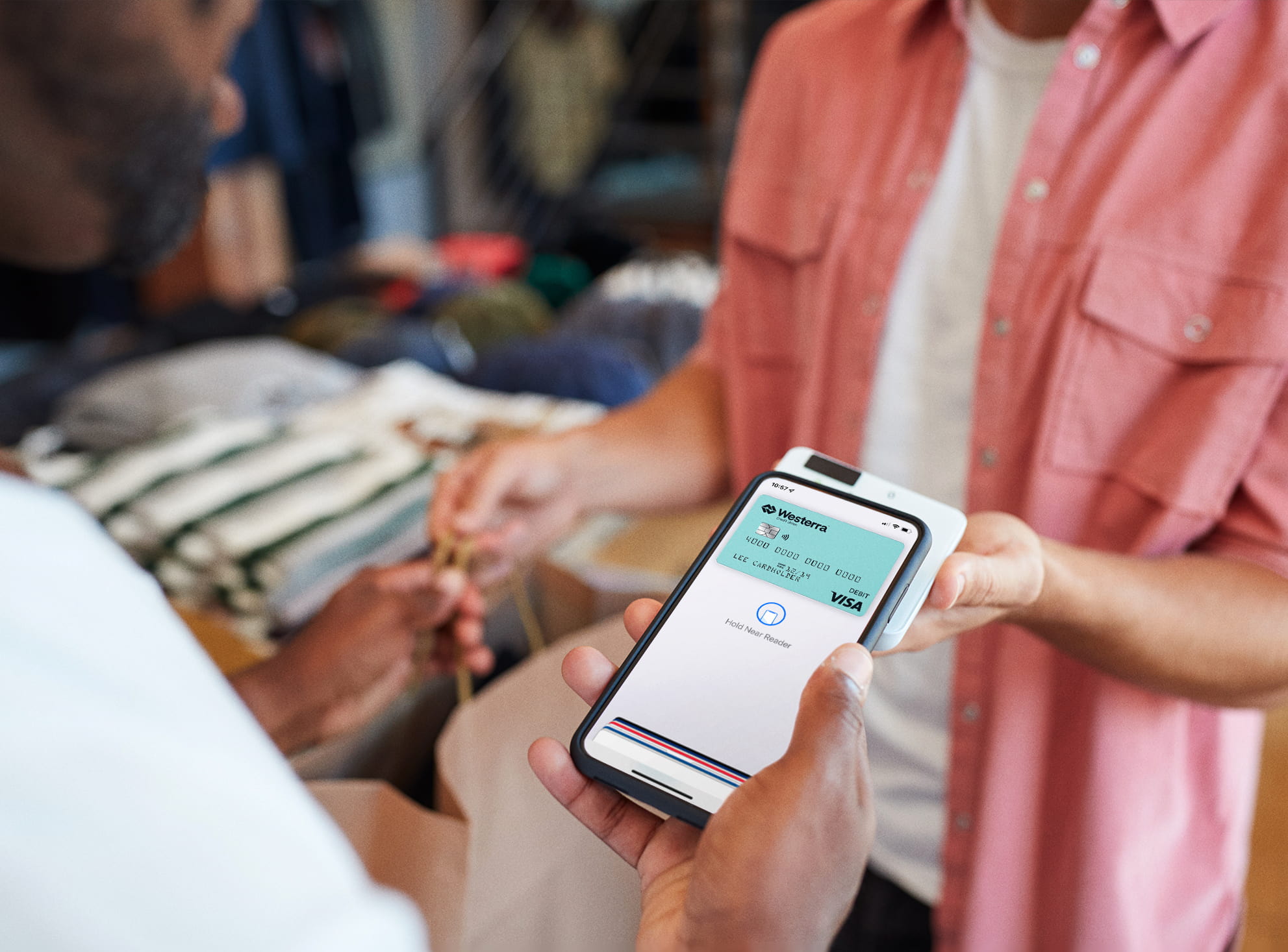 Woman handing a salesperson a credit card