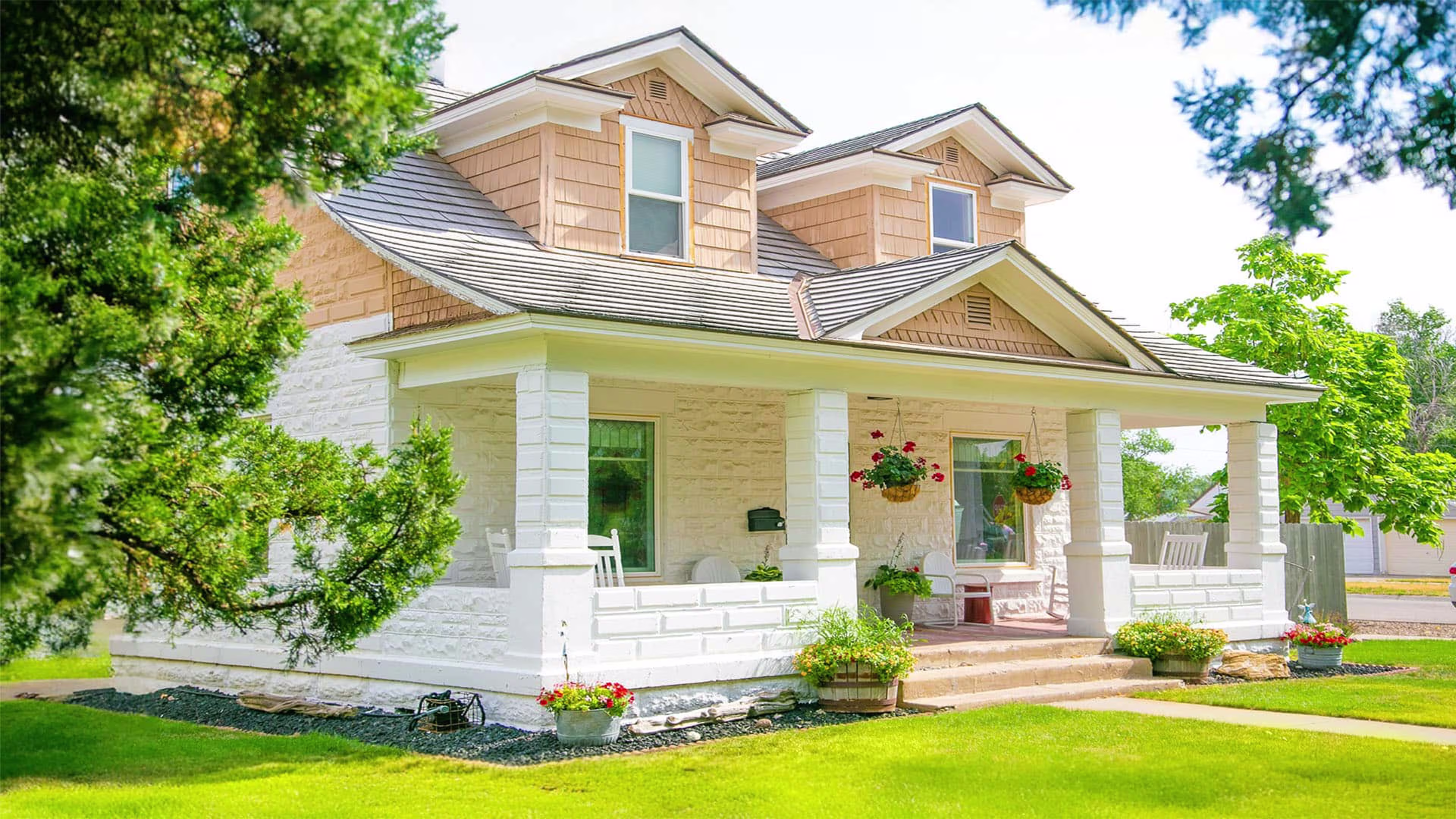 Bright yellow house in a sunny setting, representing the potential of mortgage refinance, debt consolidation loans, and competitive refinance rates to help homeowners achieve financial goals.