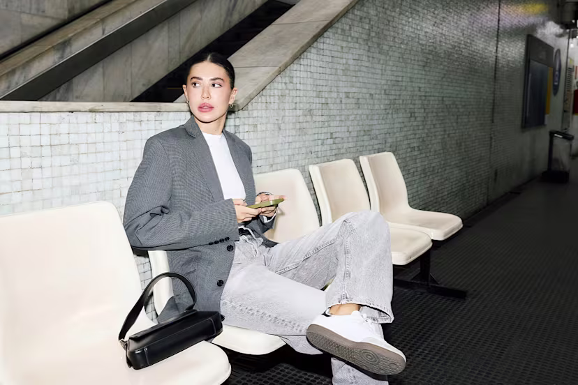 Hero Business Services 1500x1000 woman sitting on couch with leg crossed