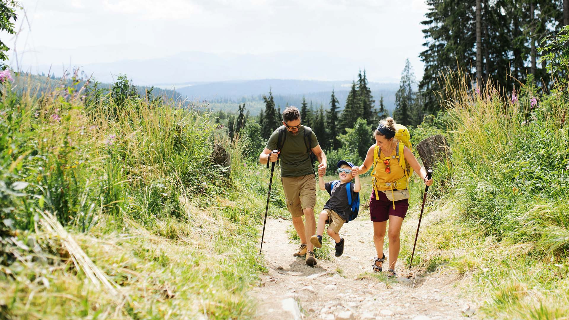 Family hiking in Denver Colorado, with the peace of mind of banking local with Westerra Credit Union. 