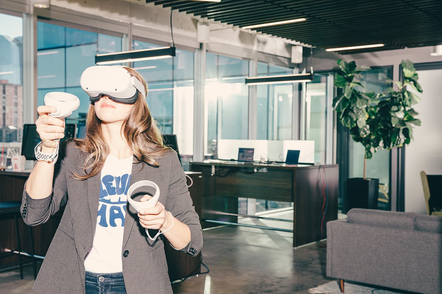 Girl in an office wearing a Quest VR headset