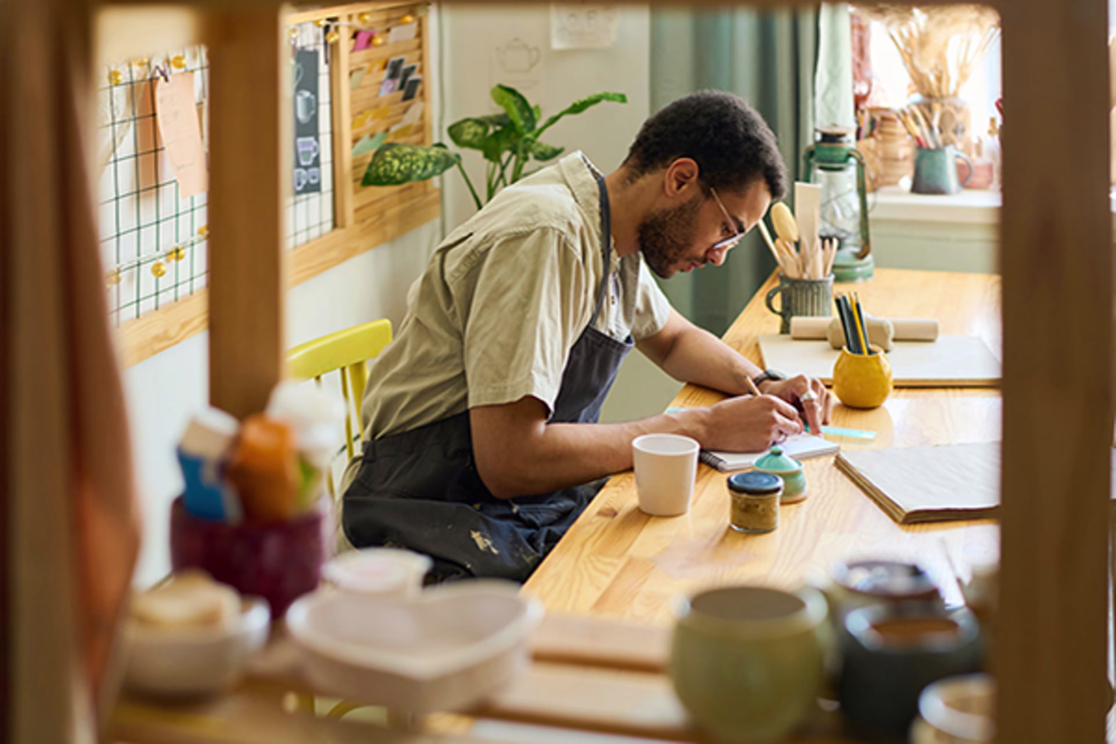 Small business owner at his desk managing finances with a Business Line of Credit from Westerra Credit Union