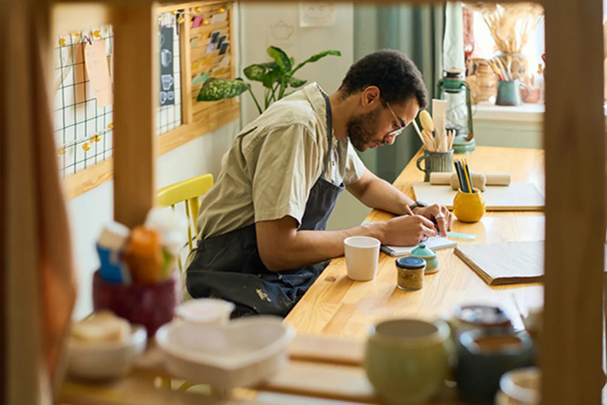 Small business owner at his desk managing finances with a Business Line of Credit from Westerra Credit Union