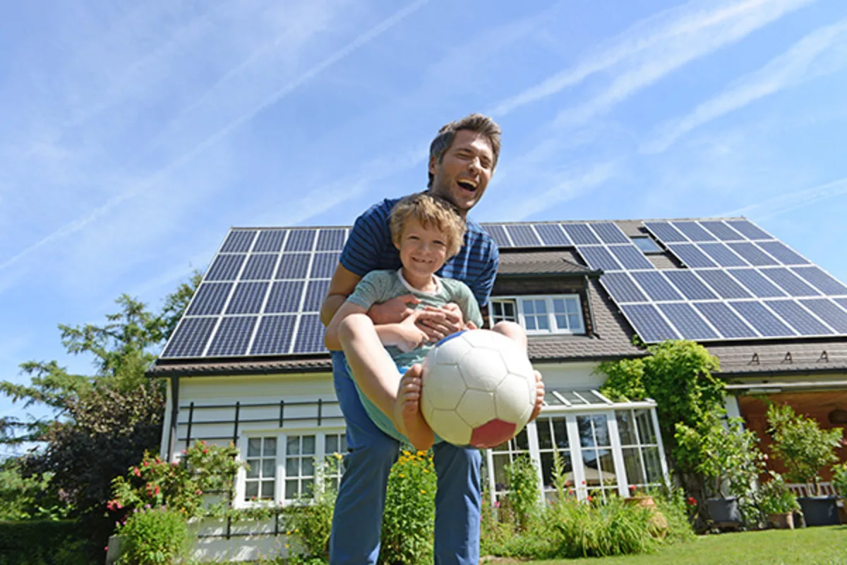 Father and son enjoying their energy efficient home, with a Westerra RENU Loan.