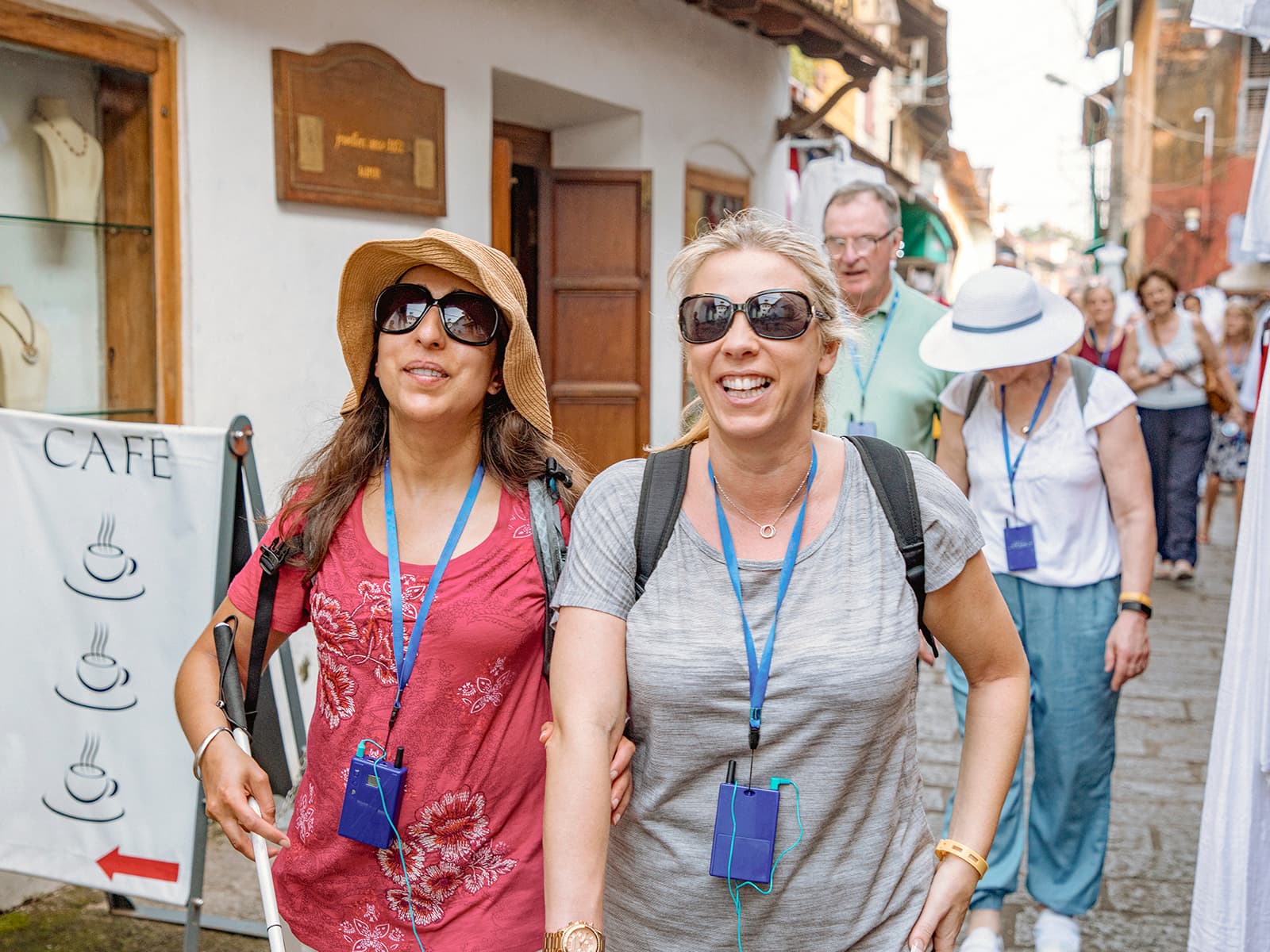 Two women on vacation taking an audio tour