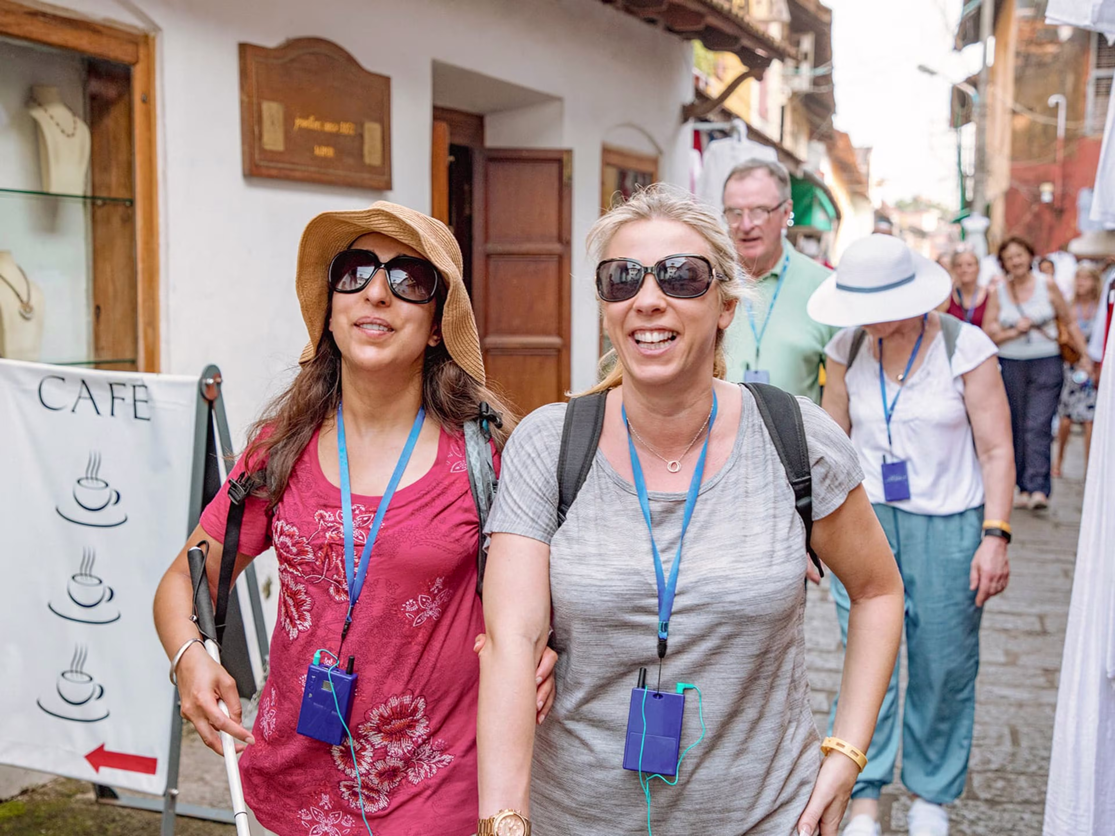Two women on vacation taking an audio tour