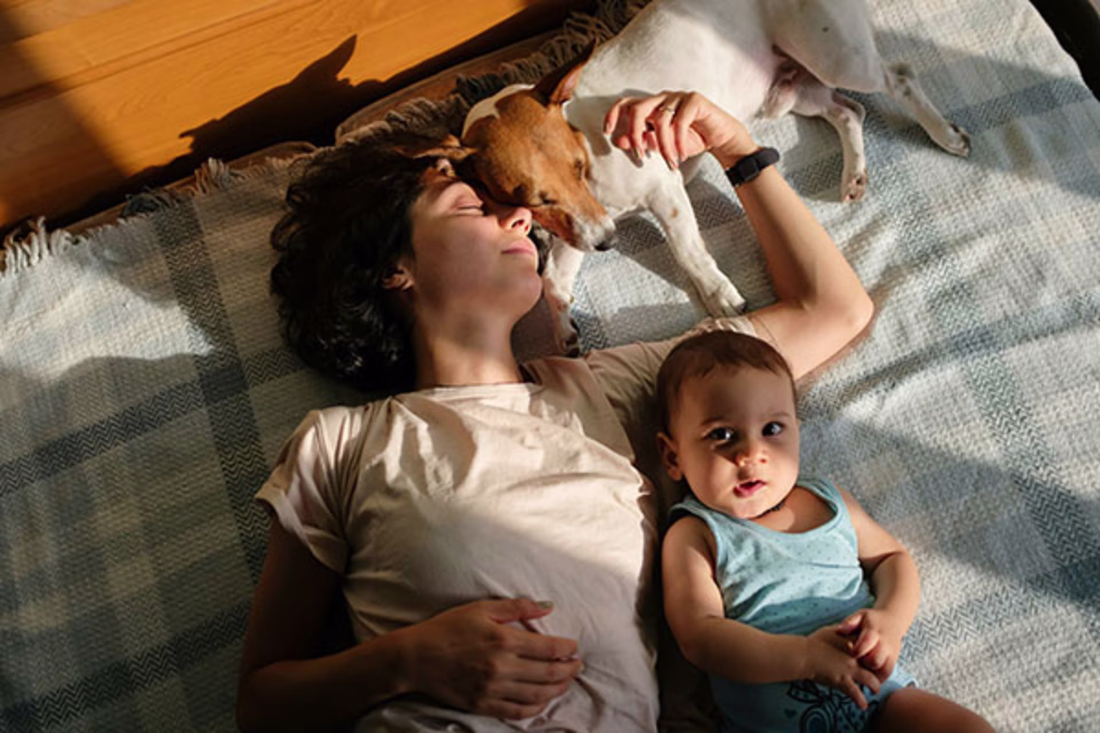 Mom with her baby and dog at home, with overlay text highlighting Westerra's conventional mortgage options—trusted by families across Colorado.