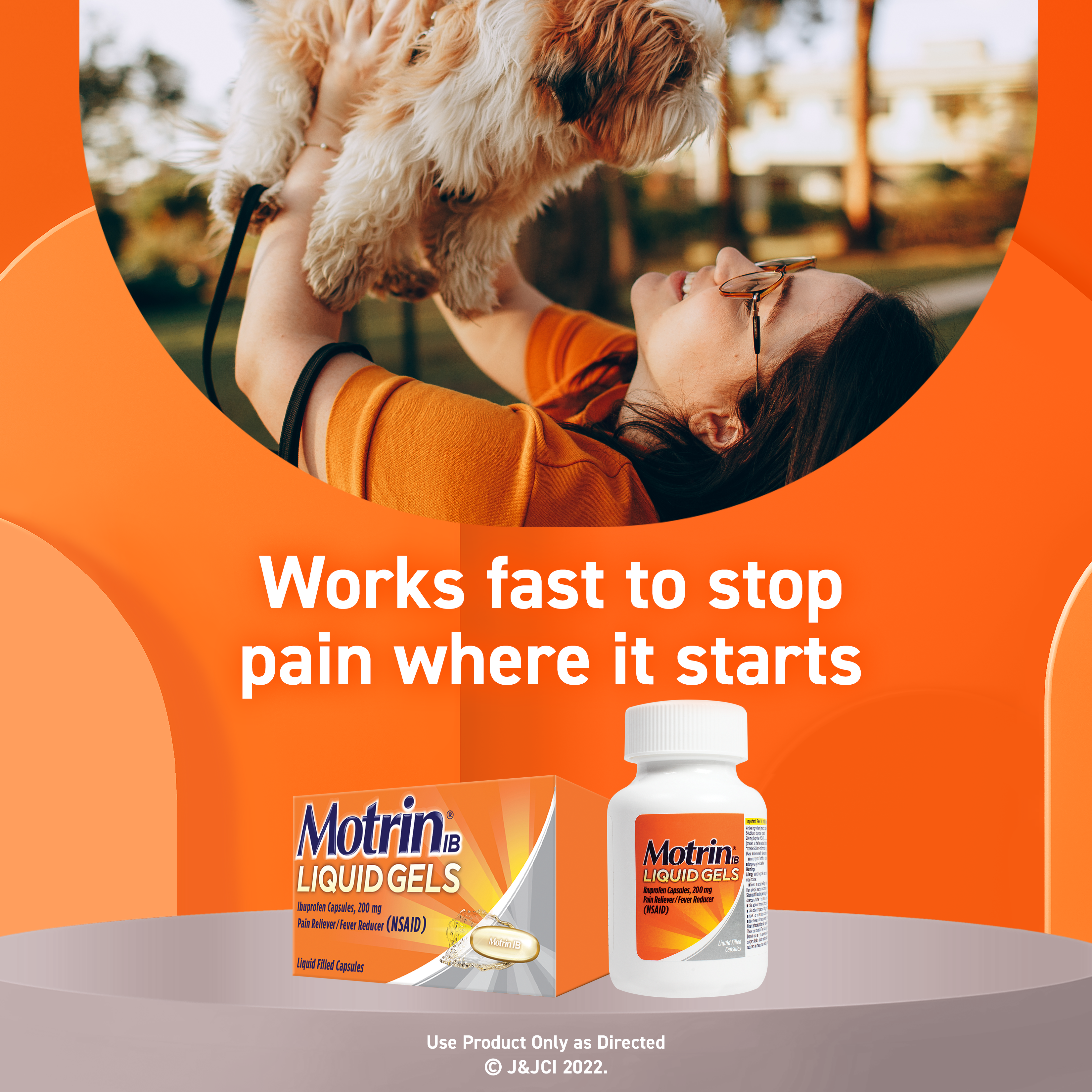 An advertisement for Motrin IB Liquid Gels pain reliever. The image shows a woman holding a dog and smiling. Text emphasizes fast pain relief.