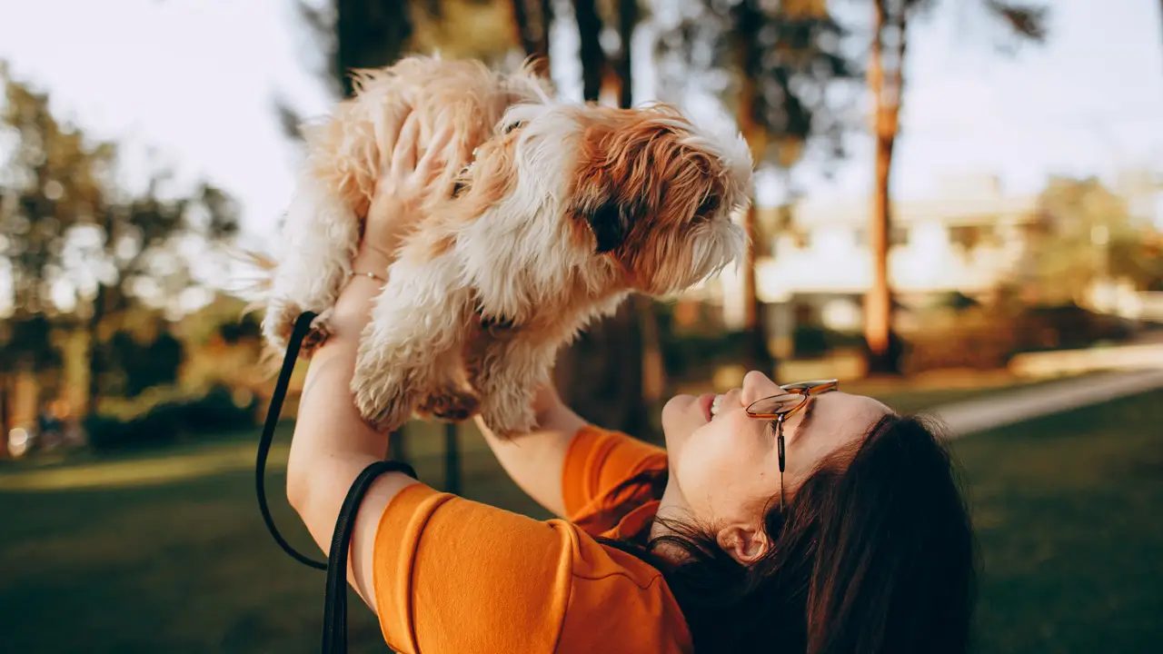 Woman holding puppy