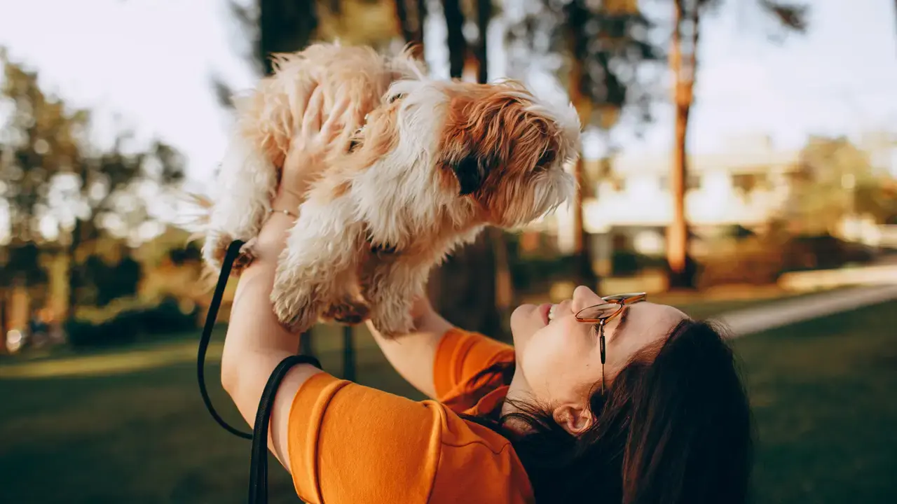 Woman holding puppy