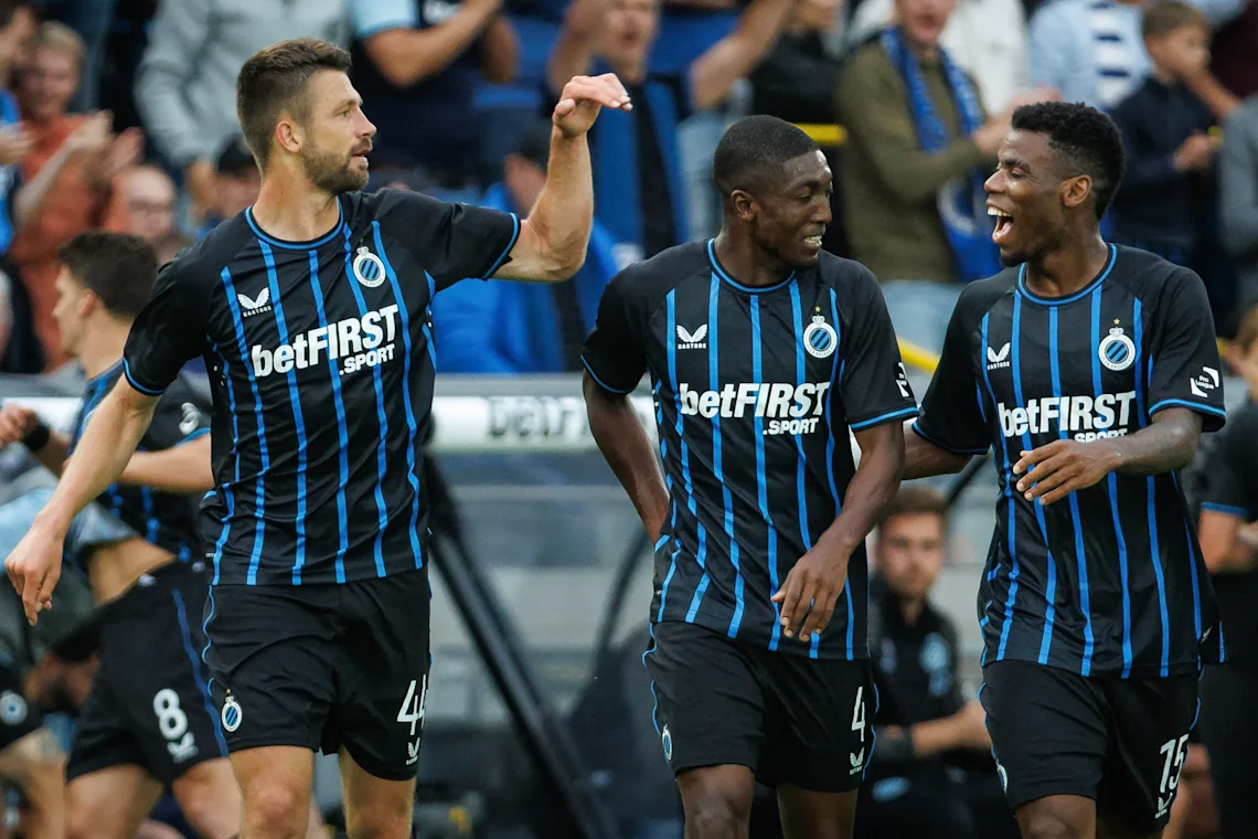 Brandon Mechele, Joel Ordonez and Raphael Onyedika celebrate during Club Brugge's 2-1 win over Genk