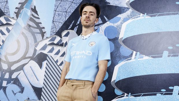 Jack Grealish models Manchester City's 2023-24 home shirt