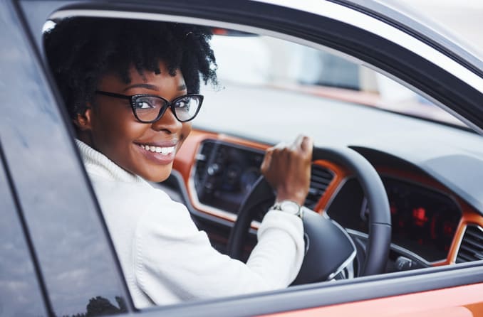 woman driving while wearing glasses