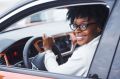 woman driving while wearing glasses