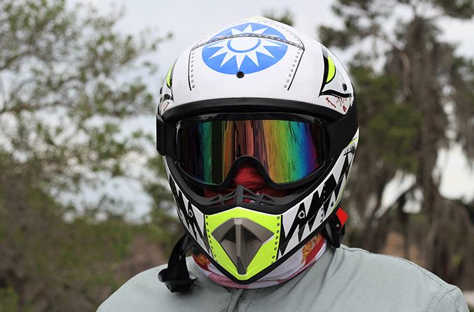 man wearing motorcycle helmet and motorcycle goggles