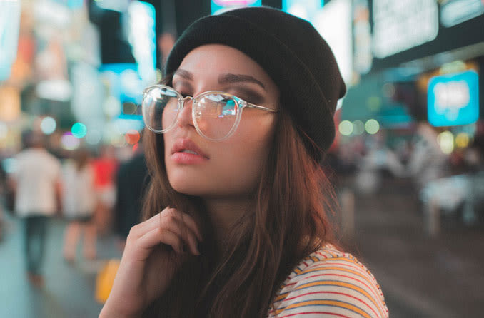 Woman with spectacle frames resting on nose