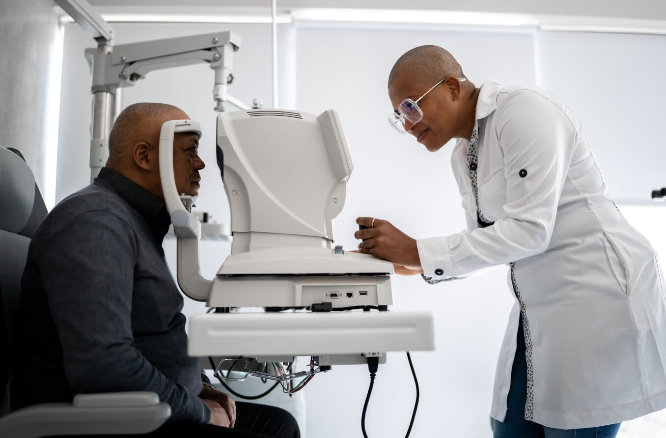 Ophthalmologist examining patient's eyes