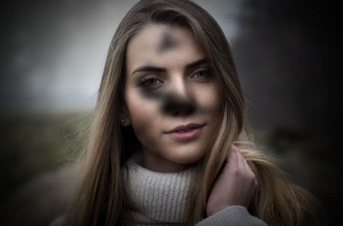 Distorted image of woman due to vision problems