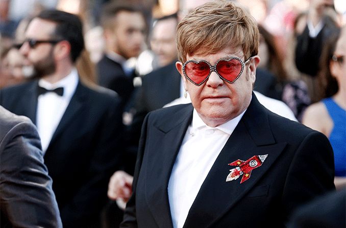 Elton John wearing cool sunglasses