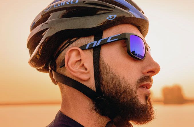 Male cyclist wearing protective sports eyewear.