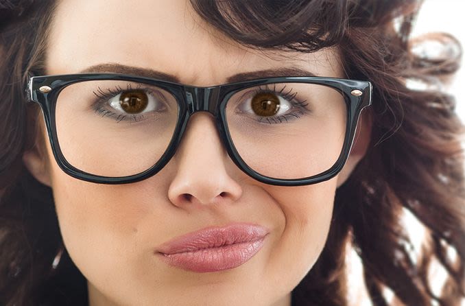 Unhappy woman with eyeglasses