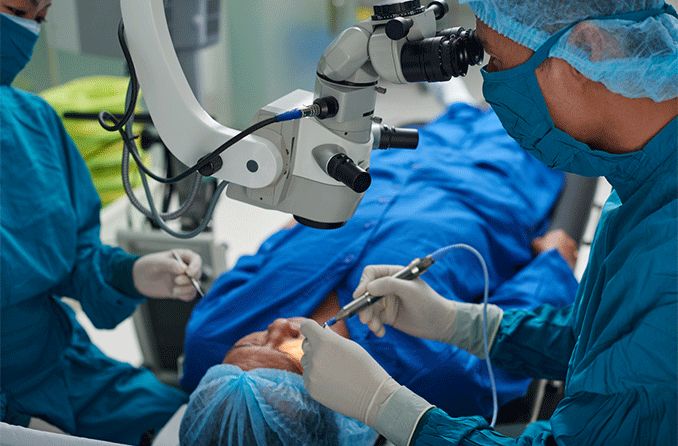 Surgeon conducting refractive cataract surgery on a patient