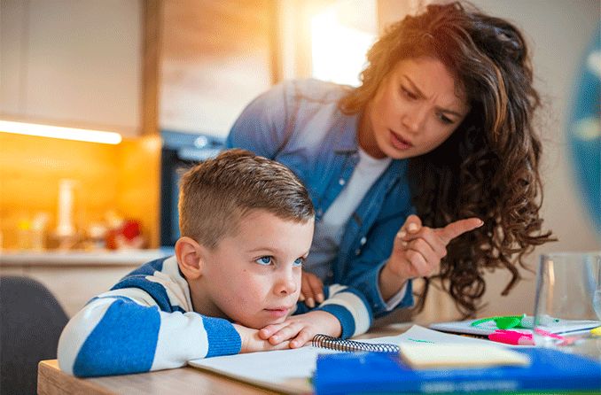 mother who suspects son of having ADHD frustrated with homework