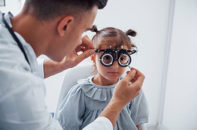 A little girl has her vision assessed by her pediatric ophthalmologist.