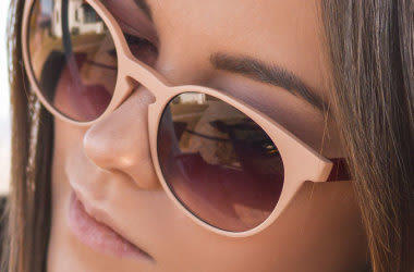 woman wearing designer sunglasses