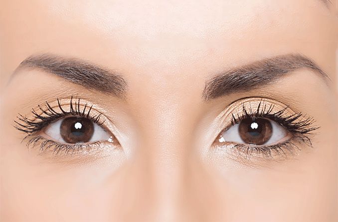 closeup of woman's eye displaying a corneal light reflex during an eye exam