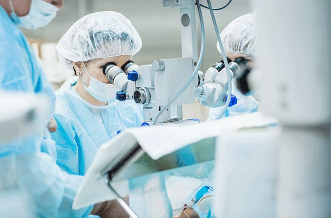 ophthalmologists performing eye surgery