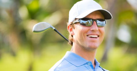 Golfer wearing performance sunglasses