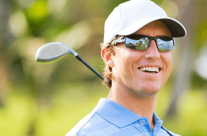 Golfer wearing performance sunglasses