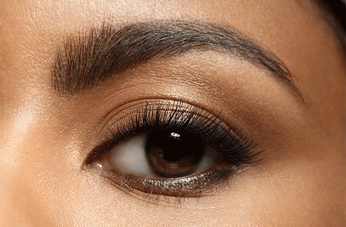 closeup of an eye with long eyelashes