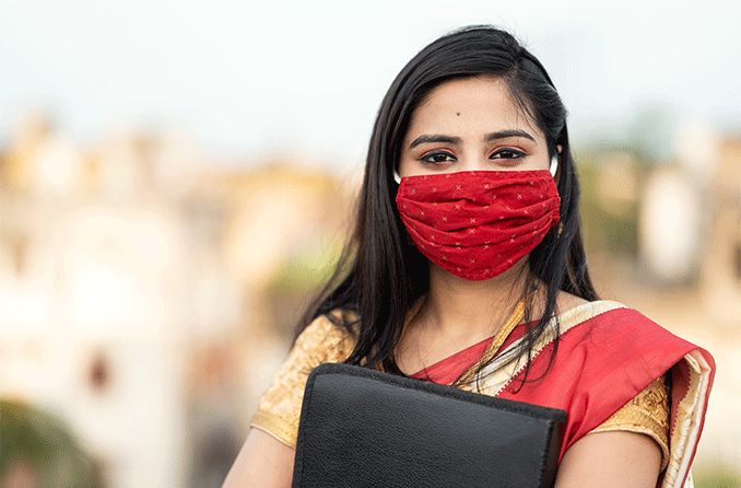 woman wearing a home made face mask to protect from coronavirus