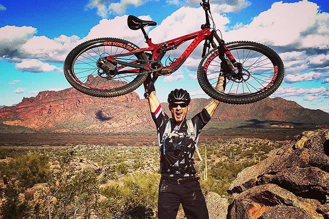 Mountain biking, glasses and helmet for man on adventure in nature