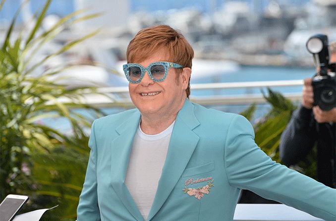 Elton John wearing his celebrity eyewear line 