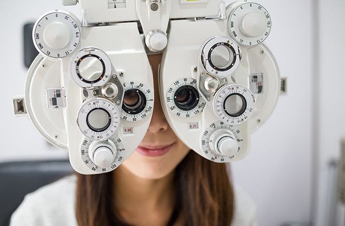 Woman getting an eye exam