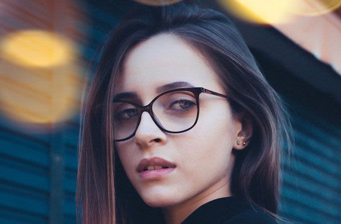 Young woman with long hair and eyeglasses