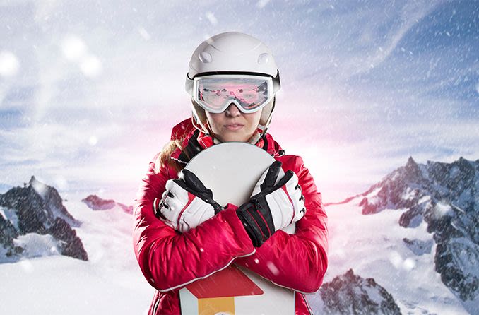 female snowboarder wearing photochromic ski goggles
